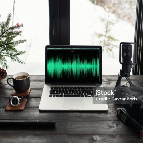 Audio / Video editing workspace office with mountain view. Photography and videography equipment.